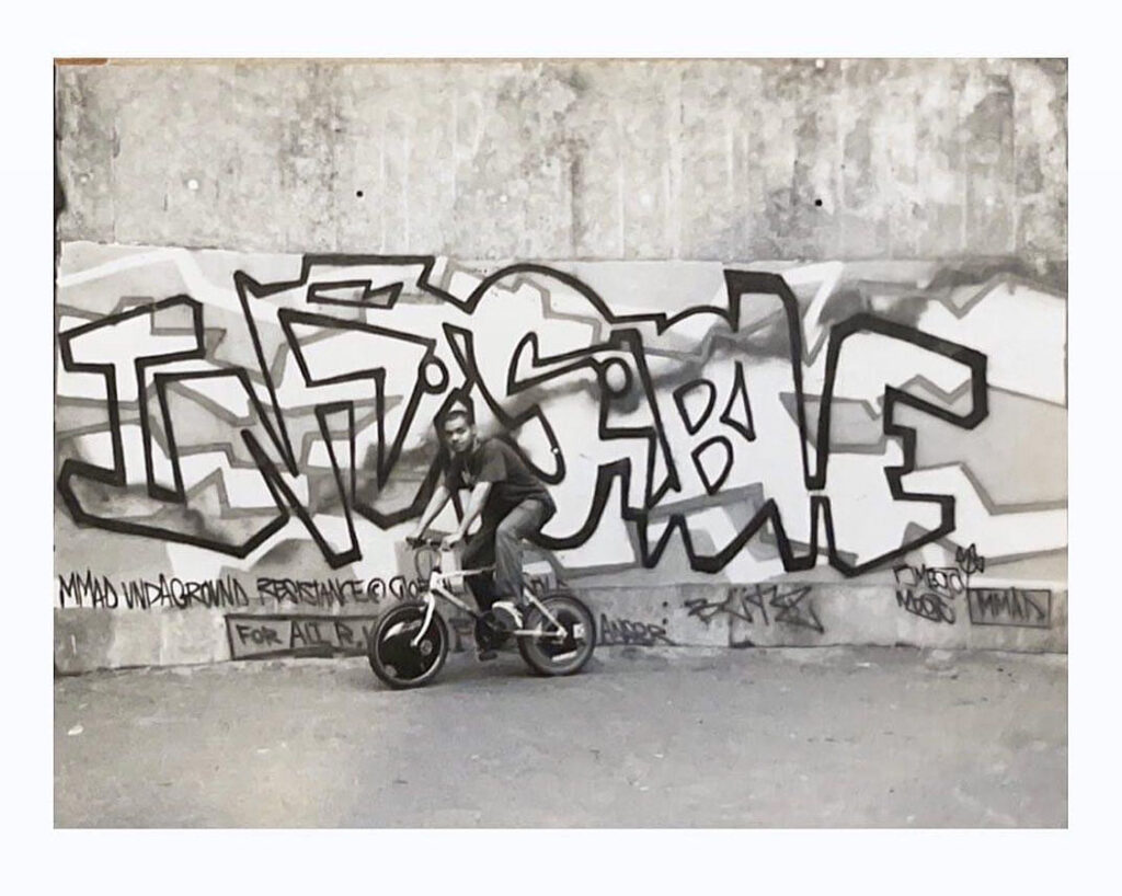 BMega in front of "Invisible," Yamate-dori, Meguro, Tokyo, c. 1995.